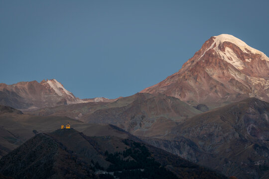 Georgia, Greater Caucasus, Stepantsminda, Gergeti Trinity Church and Mount Kazbek