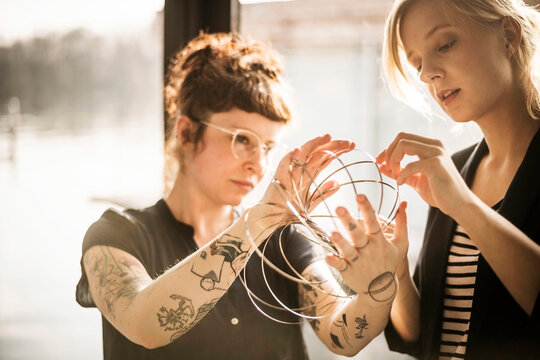 Designer adjusting ring-shaped object