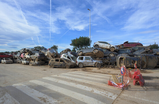 Wrecked cars stacked in junkyard