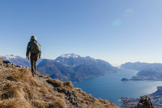 Italy, Como, woman on a hiking trip in the mountains above Lake Como