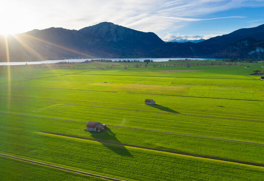 Germany, Bavaria, sunrise over Lake Kochel with Jochberg, aerial view