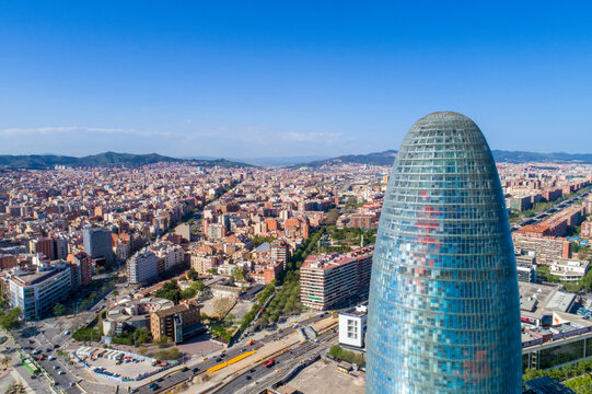 Spain, Barcelona, cityscape with Torre Glorries in the foreground