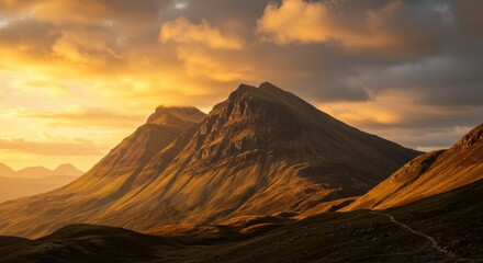 Majestic mountain landscape at sunset with dramatic clouds in scenic highlands