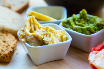 Various dip sauces on wooden table
