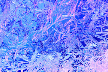 Photo of natural colorful ice texture on the frozen glass. Abstract background
