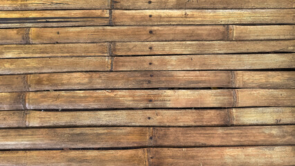 A close-up of arranged wooden planks showcasing natural texture and tones, perfect for backgrounds...