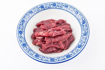 A bowl of freshly cut beef strips