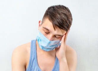 Sad Young Man in Flu Mask