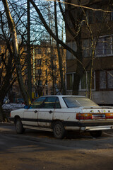 Old white car in the yard