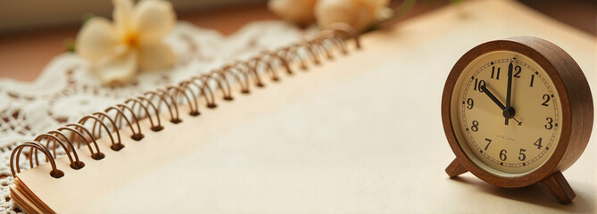 Spiral calendar mockup with wooden clock on linen background