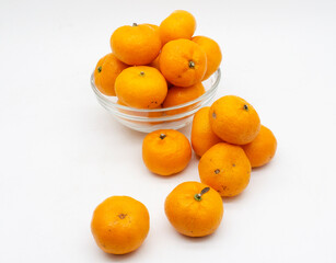 Tangerines. Close view on Fresh Mandarin Orange. Isolated on White Background. Citrus. Sweet. Juicy. Chinese. New Year. Jeruk Keprok