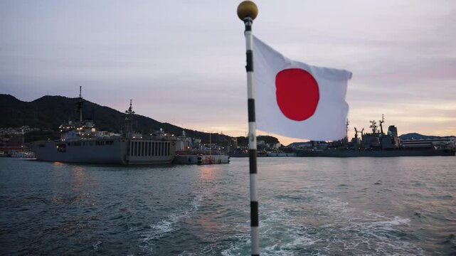 Japanese Flag Flying over Kure Japan Maritime Self Defense Force Ships