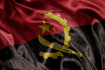 shine waving colourful realistic national flag of angola . macro shot