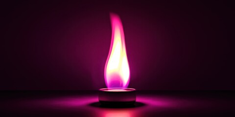 Small candle is lit and is pink in color