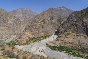 Scenic mountain landscape view on Afghanistan side of Panj river valley, Darvoz, Gorno-Badakhshan, Tajikistan