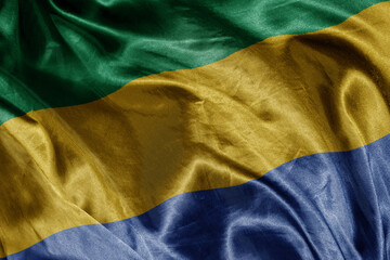 shine waving colourful realistic national flag of gabon . macro shot