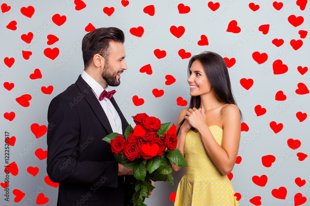 Poster portrait of bearded gentleman in tuxedo with bowtie presenting bouquet of red roses to his charming,