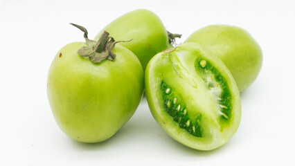 green tomatoe isolated on white background