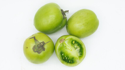 green tomatoe isolated on white background