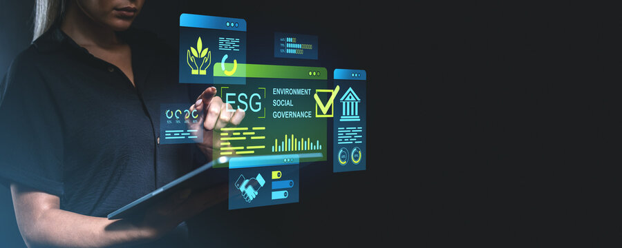 ESG investment concept with a businesswoman using holographic in - Powered by Adobe