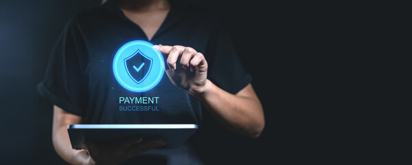Woman holding tablet with glowing shield icon and "Payment Successful" text.