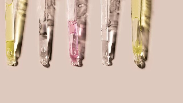 samples serum tests glass pipettes with drops of serum on a light beige background