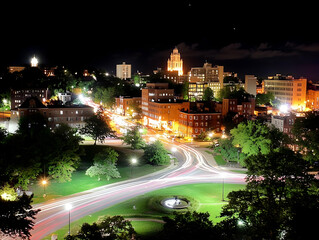 Fototapeta premium Cityscape at Night with Light Trails and Illuminated Buildings Beautifully