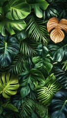 Obraz premium Lush Green Tropical Leaf Wall Design with Anthurium, Epiphytes, Ferns, and Exotic Plants