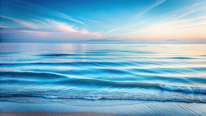 Obraz premium Serene Coastal Dawn Gentle Waves Rolling Onto a Sandy Shore Under a Tranquil Sky