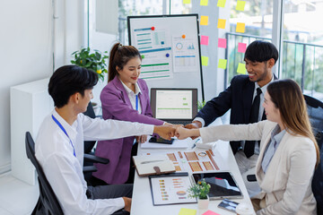 Asian Team work, presentation and meeting with office desk, collaboration and laptop or brainstorming for online project. Employee, working together research on tech for info, coworking and company.