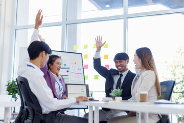 Obraz premium Asian Team work, presentation and meeting with office desk, collaboration and laptop or brainstorming for online project. Employee, working together research on tech for info, coworking and company.