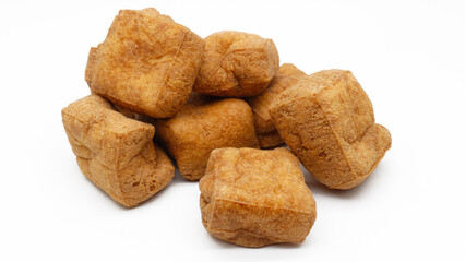 Tofu is a food prepared by coagulating soy milk and then pressing the resulting curds into solid white blocks of varying softness: silken, soft, firm.