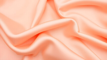 Fototapeta premium Elegant Peach Satin Fabric Close-Up with Soft Folds and Sheen
