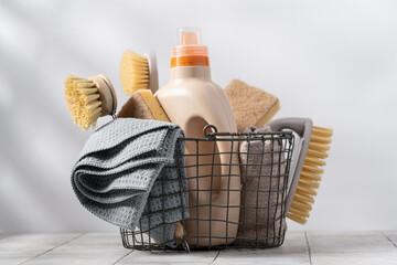 Basket with eco-friendly cleaning tools on white background. Zero waste cleaning, spring cleaning...