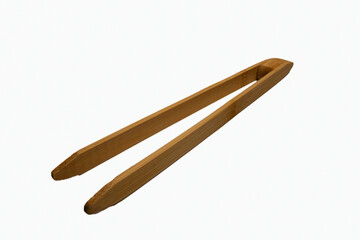 New bamboo kitchen tongs designed for grilling and serving, isolated on white. The clean, detailed shot emphasizes the natural material and functional design of this essential cooking utensil.
