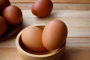 Fresh eggs on wood background