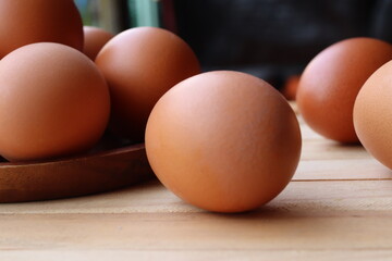 Fresh eggs on wood background