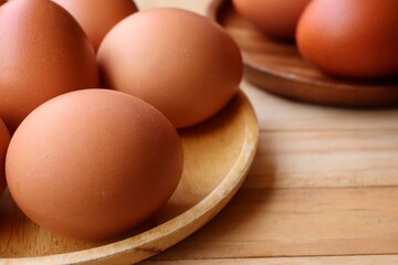 Fresh eggs on wood background