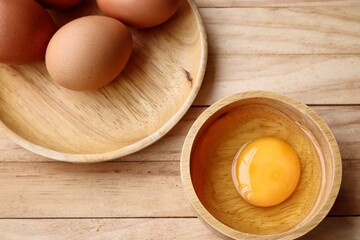 Fresh eggs on wood background