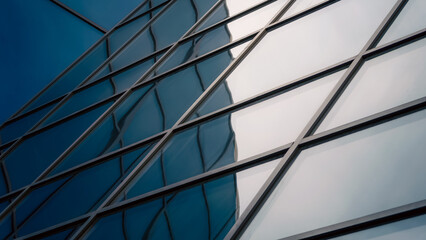 reflection with distortion in the window of a modern tall building