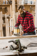 Carpenter Working with Power Tool