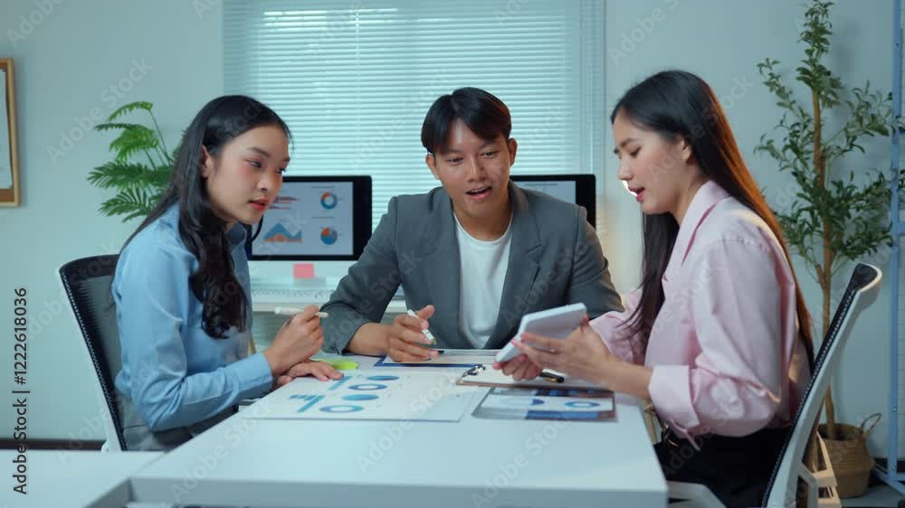 Poster asian entrepreneurs and managers are discussing and analyzing financial charts and graphs using digi