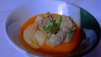 Traditional Curry Dish with Meat and Vegetables served in a bowl. Usually eaten with bread or rice.