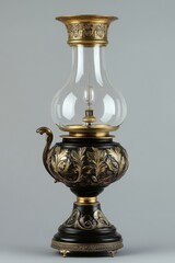 A 19th-century oil lamp with ornate brass detailing