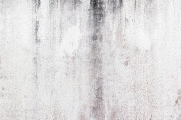 Aged concrete wall with vertical streaks and weathered texture