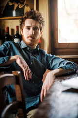 Confident hipster guy at the bar