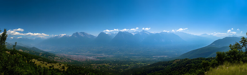 Fototapeta premium Breathtaking Aerial View of Snow-Capped Mountain Range and Green Valleys