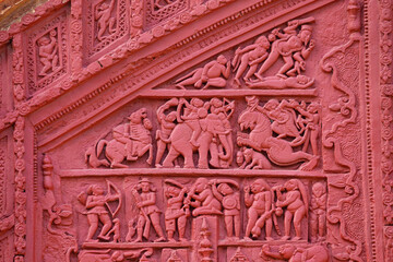 Terracotta carvings illustrating war scenes on the front façade entrance arch of Kashinath Shiva Temple, Antpur, Hooghly, West Bengal, India.