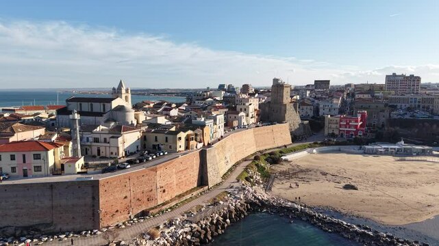 4k drone flight moving up footage (Ultra High Definition) of old town of Termoli, Italy. Spectacular Termoli beach and picturesque Italian city on Adriatic sea.