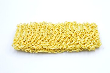 a block of uncooked instant ramen noodles